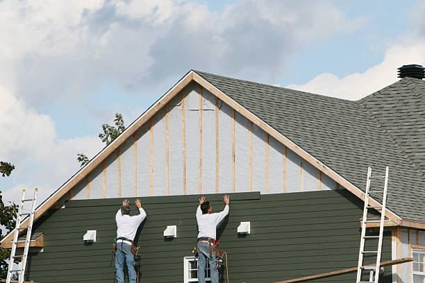 Professional Emergency Siding Repair technician working in Wellington, OH